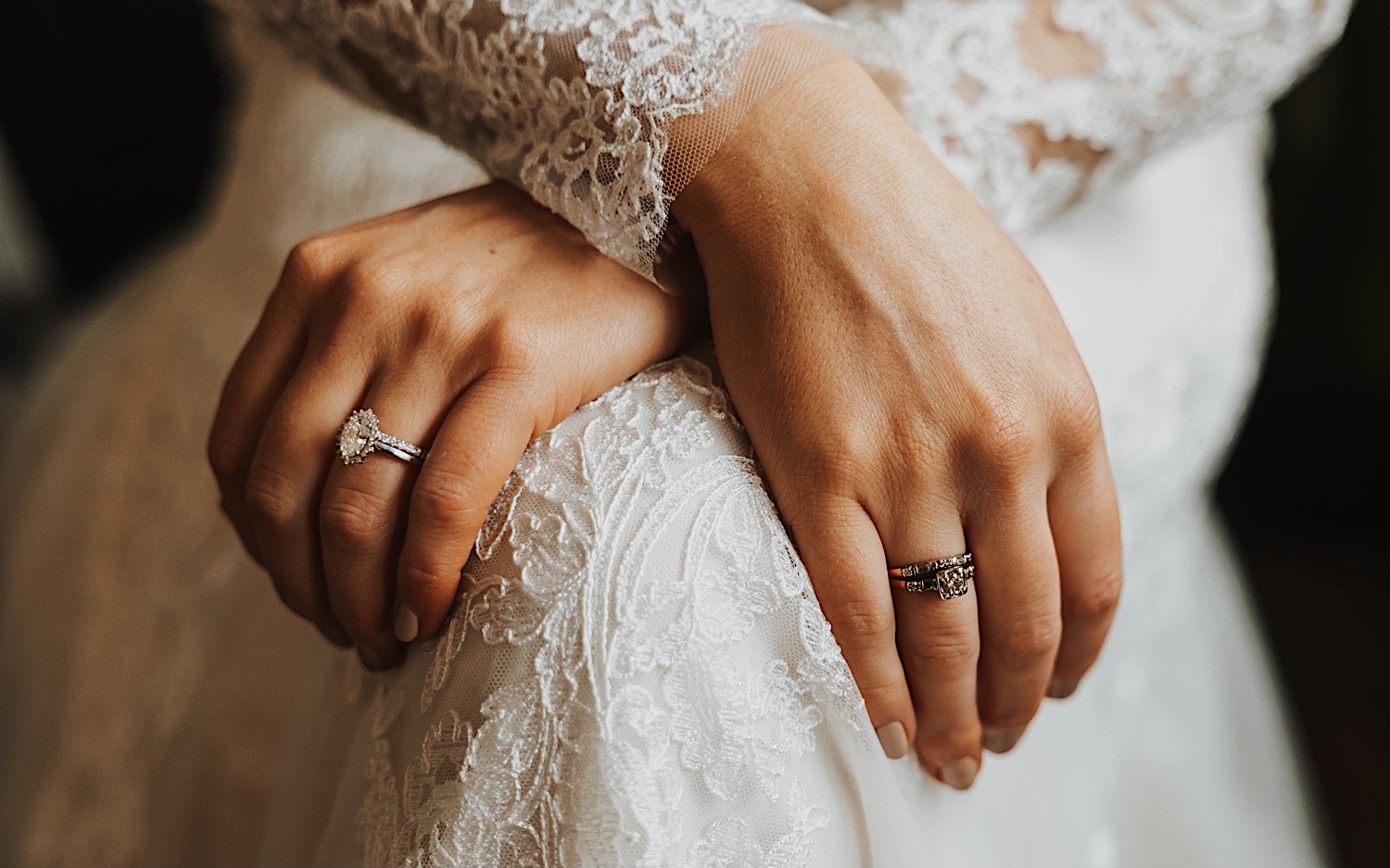 Close up photo of a bride's hand on her dress showing her wedding ring, photo taken by a Minneapolis wedding photographer