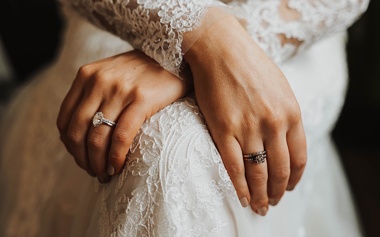 Close up photo of a bride's hand on her dress showing her wedding ring, photo taken by a Minneapolis wedding photographer Close up photo of a bride's hand on her dress showing her wedding ring, photo taken by a Minneapolis wedding photographer
