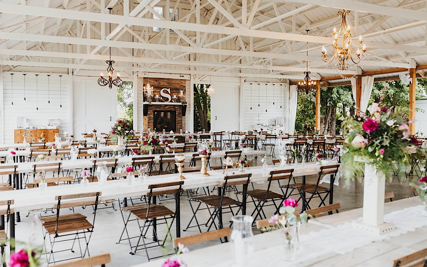 The indoor space of the wedding venue Legacy Hill Farms set up for a wedding reception