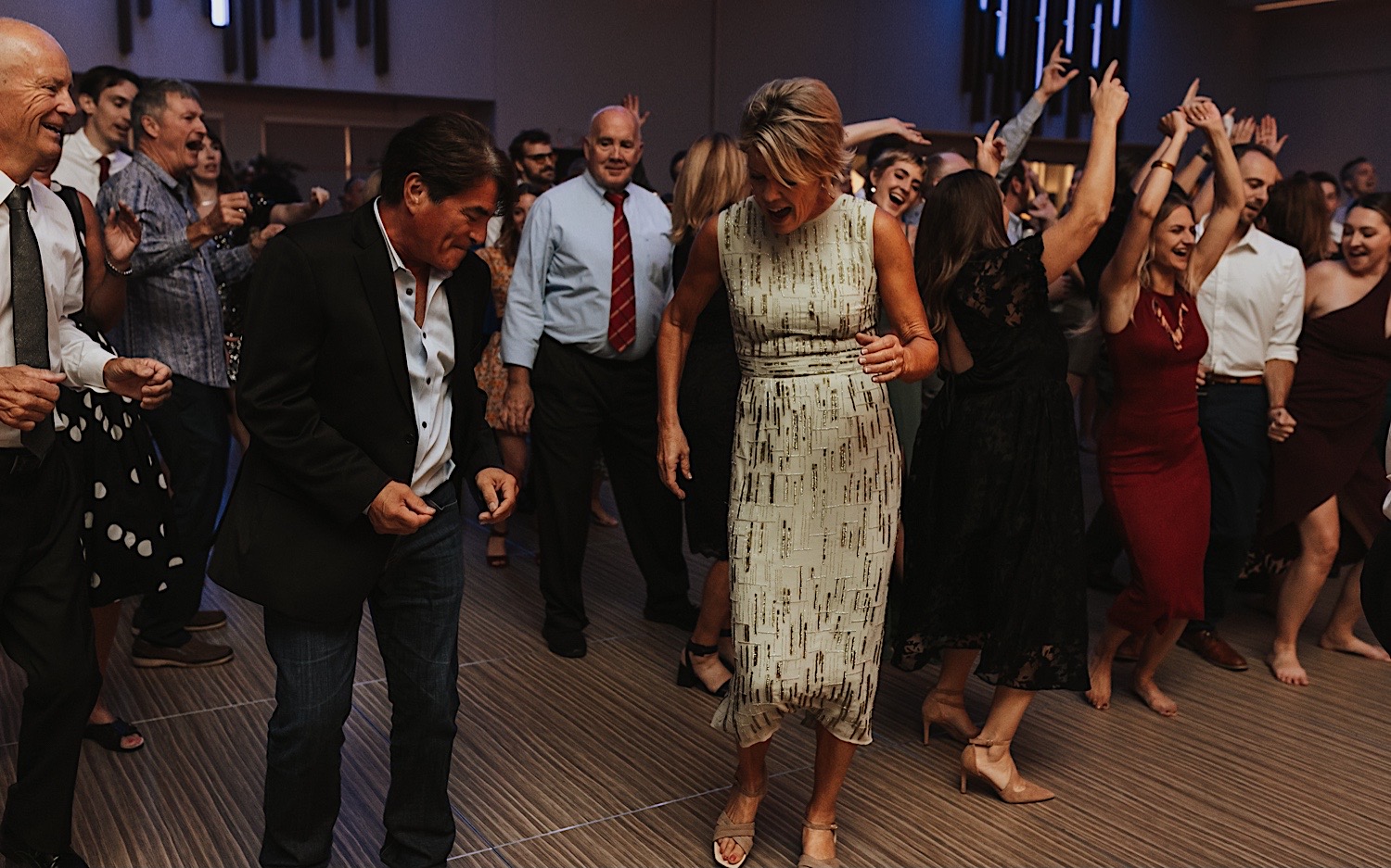 Guests of a wedding reception at the La Crosse Center pack the dance floor