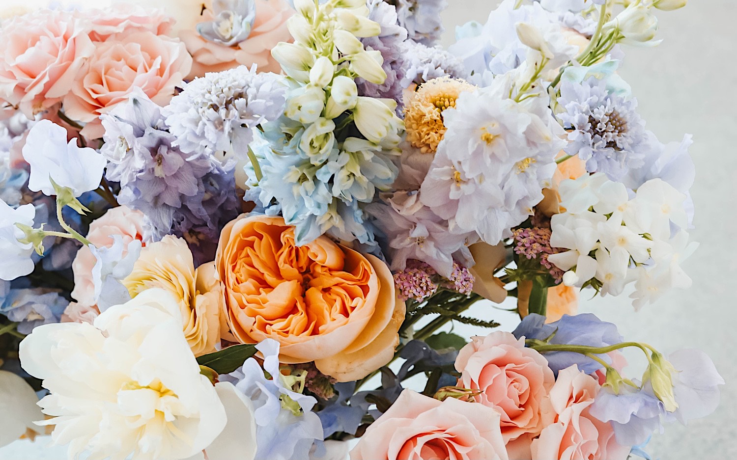 Close up photo of a bouquet of pastel colored flowers