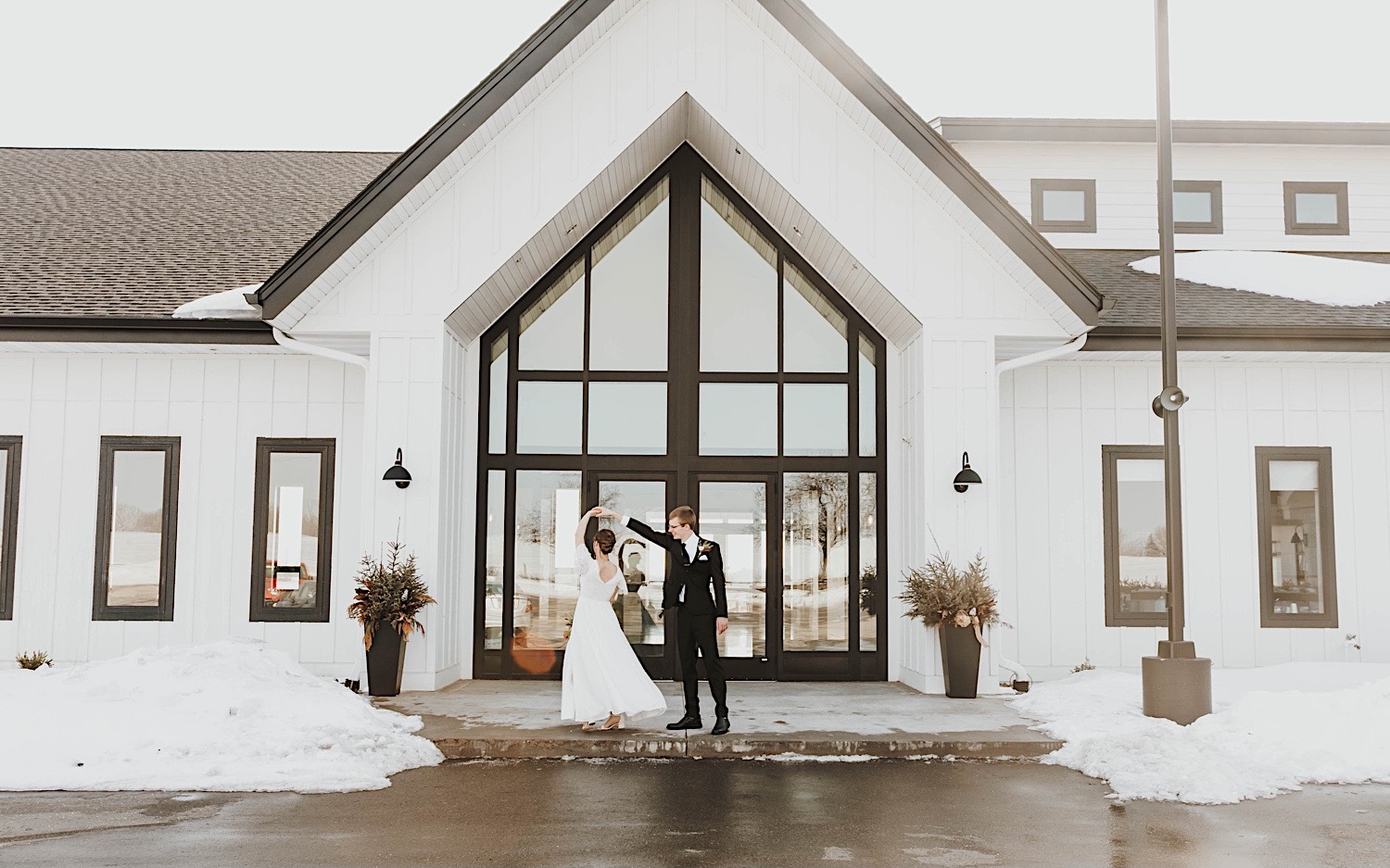 A bride and groom dance with one another while outside the Minnesota wedding venue, Woodhaven Weddings + Events